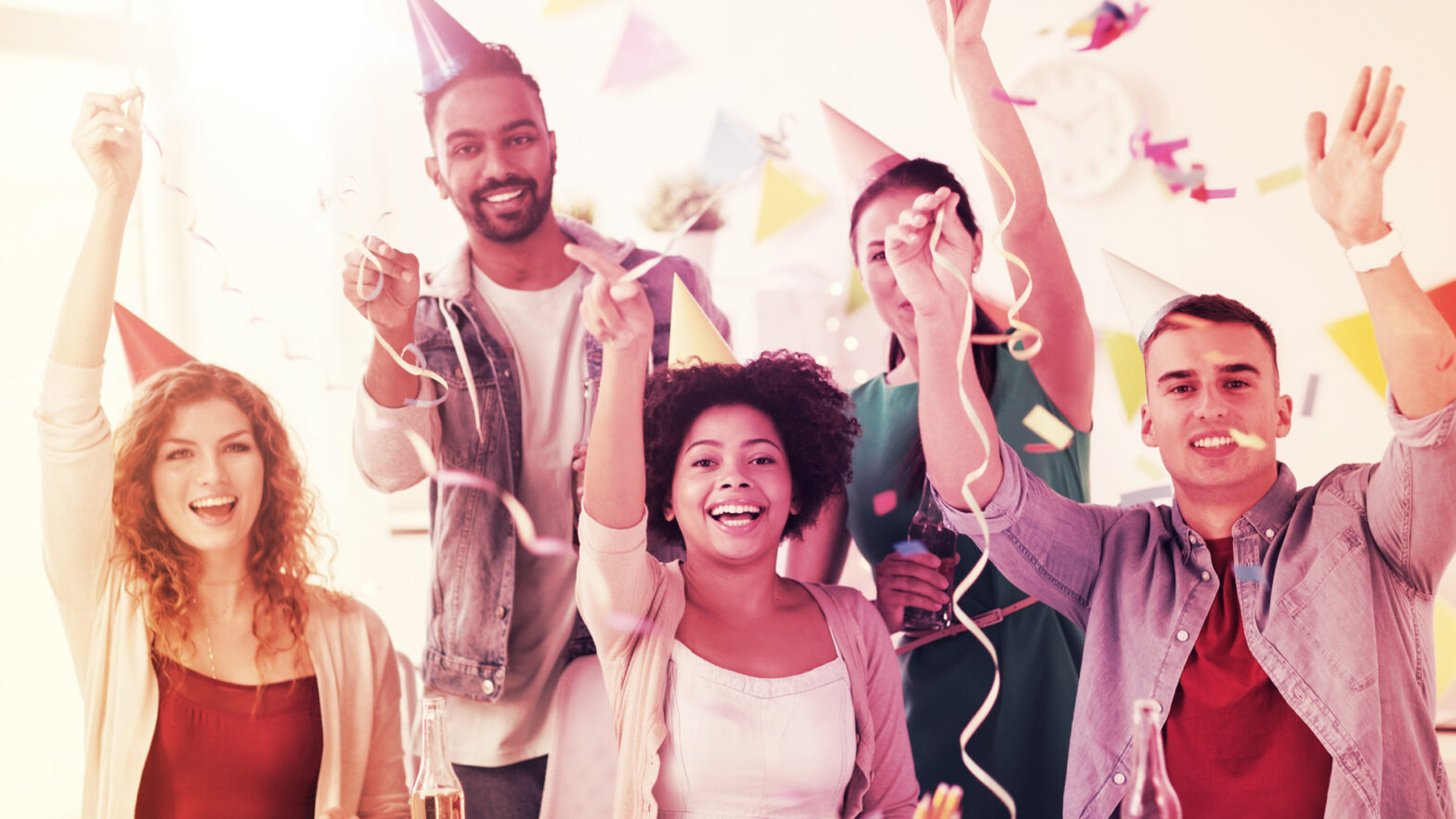 corporate, celebration and holidays concept - happy team with confetti and serpentine having fun at office birthday party